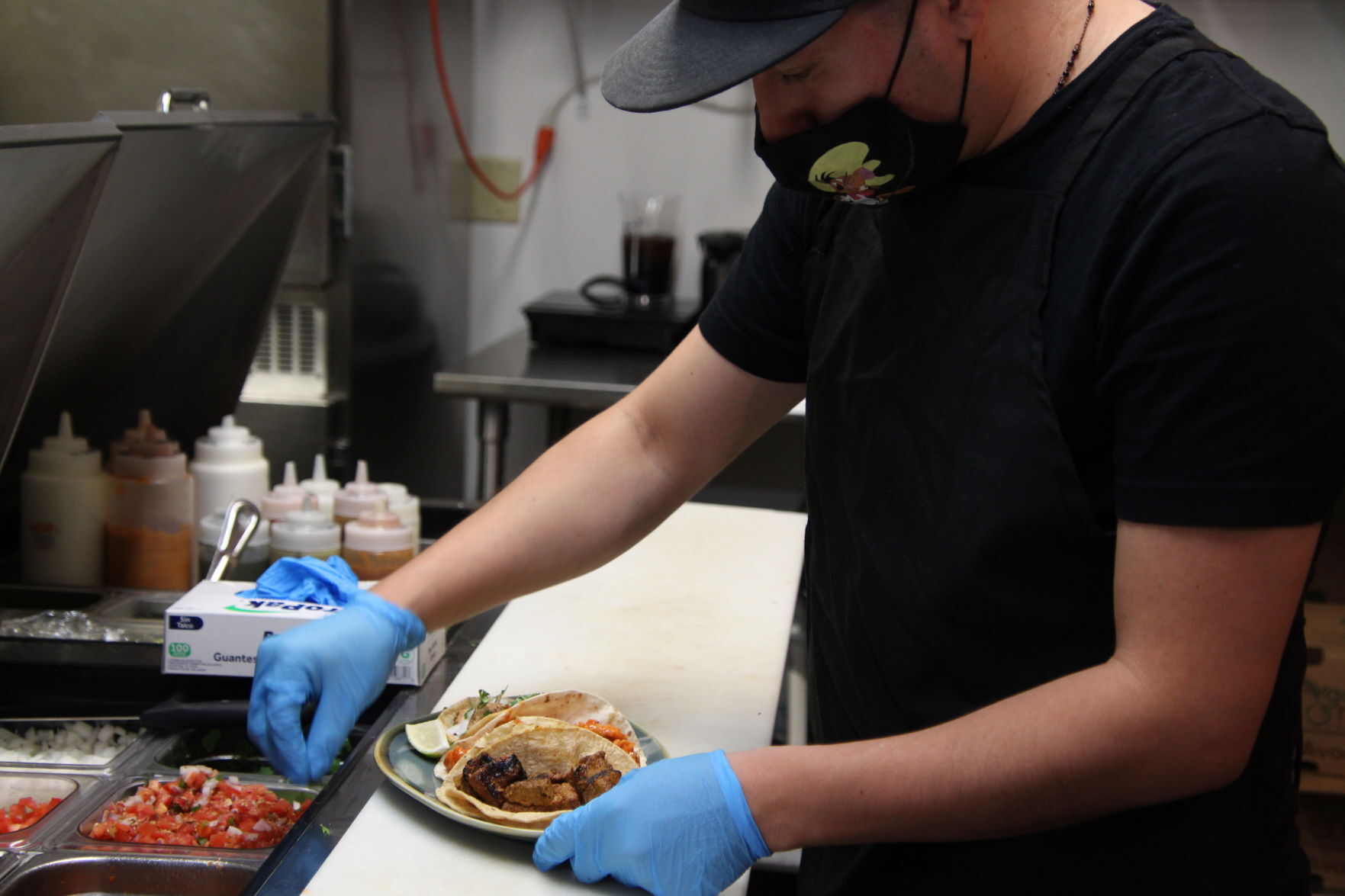 Ariel in Luchador's kitchen preparing Chimichurri Steak, Buffalo Chicken, and Traditional Chicken tacos (1).JPG